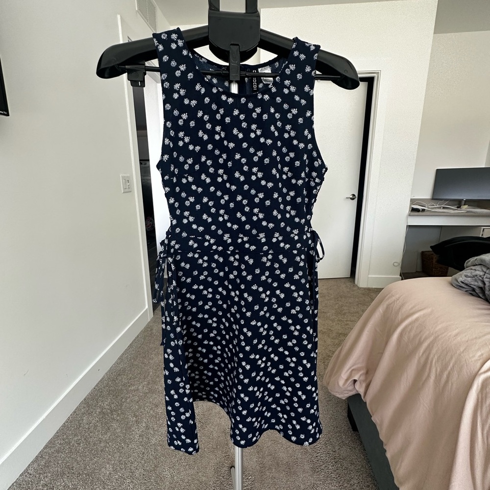 Navy Blue Sleeveless Dress with White Floral Pattern
